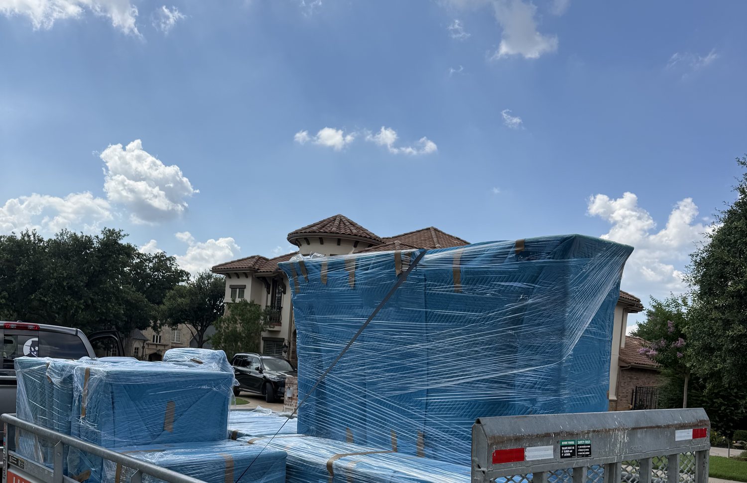 Contents wrapped, padded and loaded out on a trailer after a Fort Worth pack-out, ready for transport to storage